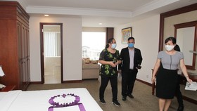 An inspection team of the municipal Department of Health makes a survey of a TTC’s hotel.