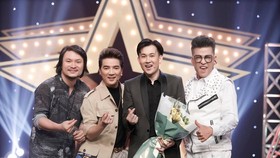 Director Hoang Nhat Nam (L), singers Dam Vinh Hung (2nd, L) and Duong Trieu Vu, MC Thanh Bach (R) join the event.