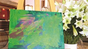 Fund-raising exhibition presents paintings by children with autism