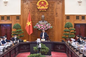 Thủ tướng Phạm Minh Chính chủ trì họp về vaccine ngừa Covid-19. ẢNH: VIẾT CHUNG