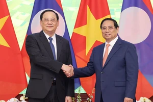 Thủ tướng Phạm Minh Chính tiếp Thủ tướng Lào Sonexay Siphandone, chiều 22-4. Ảnh: QUANG PHÚC
