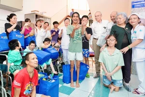 Two Swiss friends visit Hoa Binh (Peace) Village in Ho Chi Minh City