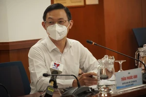 Ông Trần Phước Anh, Quyền Giám đốc Sở Ngoại vụ TPHCM thông tin tại buổi họp báo