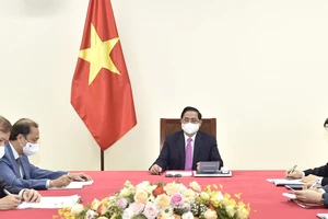 Thủ tướng Chính phủ Phạm Minh Chính điện đàm với Thủ tướng Thái Lan Prayut Chan-o-cha. Ảnh: VIẾT CHUNG