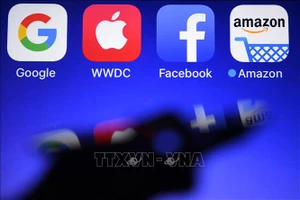 Biểu tượng của Amazon, Apple, Google và Facebook . Ảnh: AFP/TTXVN