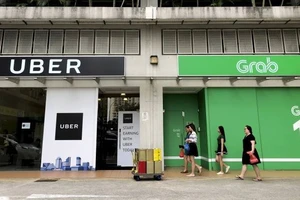 Uber sẽ có 27,5% cổ phần sau sáp nhập vào Grab. Nguồn: AP