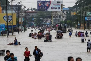 Cảnh ngập lụt sau mưa lớn kéo dài tại Bago, Myanmar ngày 28-7. Ảnh: EPA