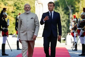 Tổng thống Pháp Emmanuel Macron và Thủ tướng Ấn Độ Narendra Modi. Ảnh: REUTERS 