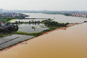 Nước sông tràn bờ do mưa lớn tại tỉnh Giang Tây, Trung Quốc. Ảnh: THX/TTXVN