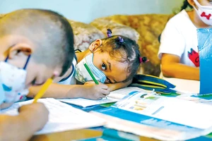 Trẻ em tham gia lớp học ở khu phố Petare, thủ đô Caracas, Venezuela. Ảnh: UNICEF
