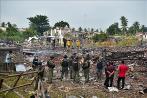 Hiện trường vụ nổ ở Sungai Kolok, tỉnh Narathiwat, miền Nam Thái Lan. Nguồn: TTXVN