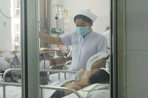 Bệnh nhân nhiễm cúm A/H1N1 đang nằm trong phòng cách ly tại bệnh viện Chợ Rẫy
