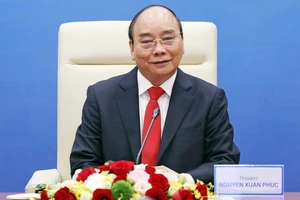 Chủ tịch nước Nguyễn Xuân Phúc tham dự phiên thảo luận tại điểm cầu Hà Nội. Ảnh: TTXVN