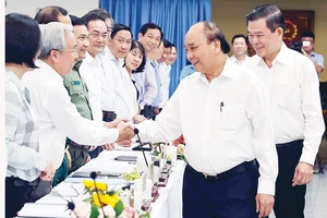 Chủ tịch nước Nguyễn Xuân Phúc với các đại biểu dự buổi làm việc. Ảnh: TTXVN
