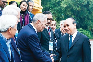 Chủ tịch nước Nguyễn Xuân Phúc với các đại biểu tại buổi tiếp. Ảnh: TTXVN