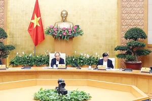 Thủ tướng Nguyễn Xuân Phúc chủ trì phiên họp Thường trực Chính phủ về giải pháp bình ổn giá thịt heo. Ảnh: TTXVN