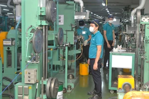 Sản xuất dây cáp điện xuất khẩu tại Công ty Nissei Electric trong KCX Linh Trung 1, TP Thủ Đức. Ảnh: CAO THĂNG