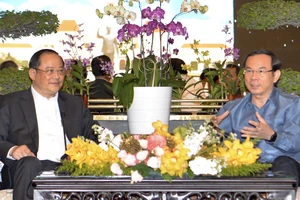 Bí thư Thành ủy TPHCM Nguyễn Văn Nên tiếp Phó Thủ tướng Lào Sonexay Siphandone. Ảnh: CAO THĂNG