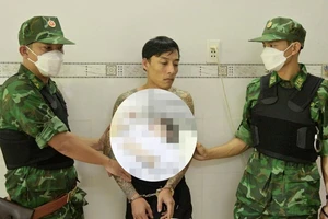 Đối tượng Nguyễn Hồ Ngọc Vinh bị lực lượng chức năng bắt giữ. Ảnh: BĐBP