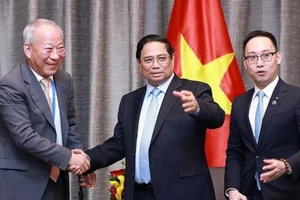 Thủ tướng Phạm Minh Chính tiếp ông Nghiêm Giới Hòa, nhà sáng lập Tập đoàn Xây dựng Thái Bình Dương. Ảnh: TTXVN