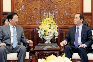 Chủ tịch nước Trần Đại Quang và Đại sứ Trung Quốc Hồng Tiểu Dũng trong buổi tiếp. Ảnh: TTXVN