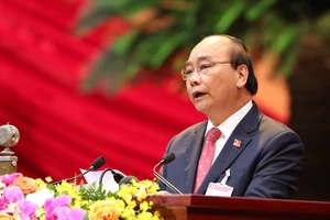 Thủ tướng Nguyễn Xuân Phúc trình bày diễn văn khai mạc Đại hội đại biểu toàn quốc lần thứ XIII của Đảng Cộng sản Việt Nam. Ảnh: VIẾT CHUNG