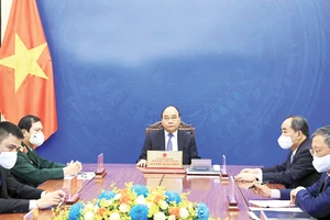 Chủ tịch nước Nguyễn Xuân Phúc điện đàm với Tổng Thư ký Liên hiệp quốc Antonio Guterres. Ảnh: TTXVN