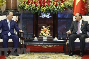 Chủ tịch nước Nguyễn Xuân Phúc tiếp nguyên Thủ tướng Nhật Bản Suga Yoshihide. Ảnh: TTXVN