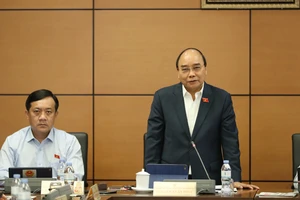 Chủ tịch nước Nguyễn Xuân Phúc phát biểu thảo luận tại tổ ĐBQH TPHCM về tình hình kinh tế - xã hội. Ảnh: QUANG PHÚC 