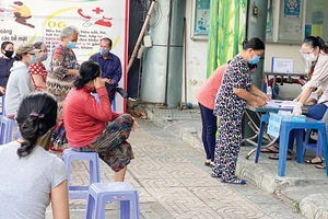 Người dân tổ 52, xã Thới Tam Thôn, huyện Hóc Môn đã nhận hỗ trợ 