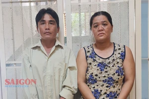 Vợ chồng Nguyễn Thanh Đức - Nguyễn Thị Thu Vân tại cơ quan công an.