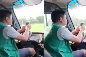 Hình ảnh tài xế xe buýt vừa lái xe vừa lướt điện thoại. Ảnh cắt từ clip.