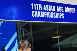 Tuyển thủ trẻ Hoàng Quy của đội bơi Việt Nam có mặt ở Philippines. Ảnh: THANH HUYỀN