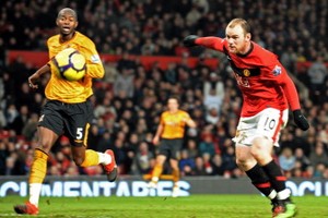 Four-star Rooney sends United top