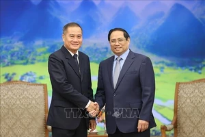Thủ tướng Phạm Minh Chính tiếp Tổng Giám đốc Thông tấn xã Pathet Lào (KPL) Khampheuy Philapha. Ảnh: TTXVN