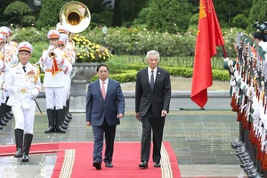 Thủ tướng Phạm Minh Chính chủ trì lễ đón chính thức Thủ tướng Singapore Lý Hiển Long 