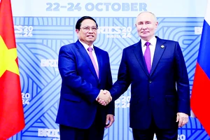 Thủ tướng Phạm Minh Chính với Tổng thống Liên bang Nga Vladimir Putin, Chủ tịch Nhóm BRICS năm 2024. Ảnh: TTXVN