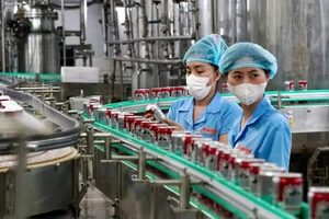 Dây chuyền sản xuất theo tiêu chuẩn Halal của Công ty TNHH SX-TM Tân Quang Minh - BIDRICO, Khu công nghiệp Vĩnh Lộc, huyện Bình Chánh, TPHCM. Ảnh: HOÀNG HÙNG