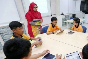 Một lớp học sử dụng máy tính bảng ở Malaysia. Ảnh: New Straits Times