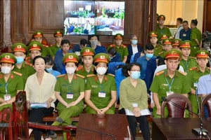 Các bị cáo tại phiên tòa ngày 14-3. Ảnh: CAO THĂNG 