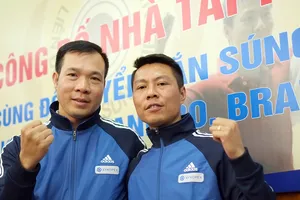 Xạ thủ Trần Quốc Cường (phải) được ISSF điền tên trong danh sách tính chuẩn của ISSF.