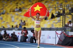 Bùi Thị Thu Thảo ăn mừng HCV nhảy xa nữ tại Asiad 18. Ảnh: DŨNG PHƯƠNG