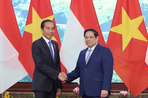 Thủ tướng Phạm Minh Chính và Tổng thống Indonesia Joko Widodo. Ảnh: VIẾT CHUNG