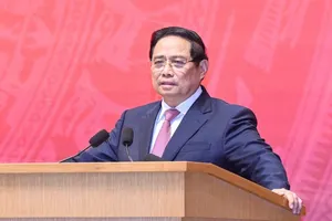 Thủ tướng Phạm Minh Chính đến dự Hội nghị toàn quốc tổng kết việc thực hiện Nghị quyết 36-NQ/TW về công tác đối với người Việt Nam ở nước ngoài ngày 25-12. Ảnh: VIẾT CHUNG.