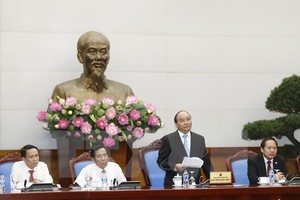 ​ Prime Minister Nguyen Xuan Phuc speaks at a meeting with leaders of press agencies on June 18 (Photo: VNA)