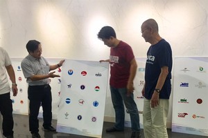 Getting ready: Organisers and logo designers are preparing for the Logo Việt Nam 2018 exhibition. — Photo courtesy of the organisers’ board