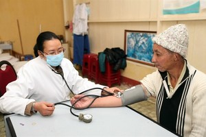 A man with mental illness is cared for at the Social Protection Centre in the Central Highland province of Lam Dong. About 30 percent of Vietnamese population or 28.2 million are suffering from mental health issues, with 25 percent experiencing depression
