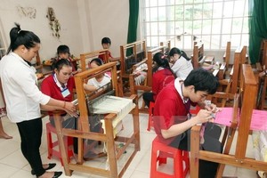 A vocational training class for disabled people (Photo: VNA)