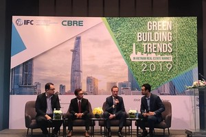 A panel discussion at a conference on green building in HCM City where experts stressed the benefits of adopting such standards. (Photo: VNA)
