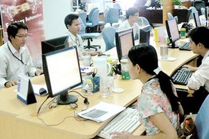 Vietnamese software professionals are working in Global CyberSoft Co., located in Quang Trung Software City. Photo by T.Ba